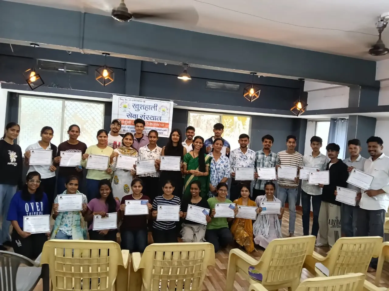 Students receiving certificates after a Vision Institute workshop